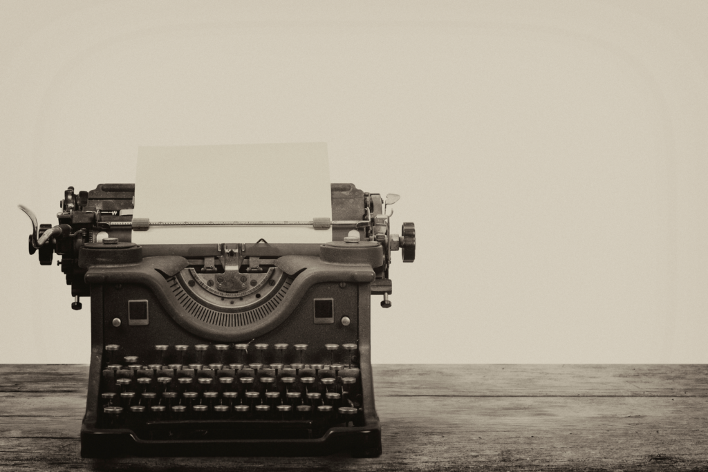 Type writer with a paper in the carriage